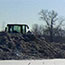 access road construction: dozers clear a trail used by workers and machinery