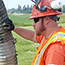 switch yard construction: workers inspect ground