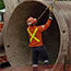 switch yard construction: large pipes are raised by crane
