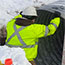 access road & culvert installation construction: piping is lowered and put in place